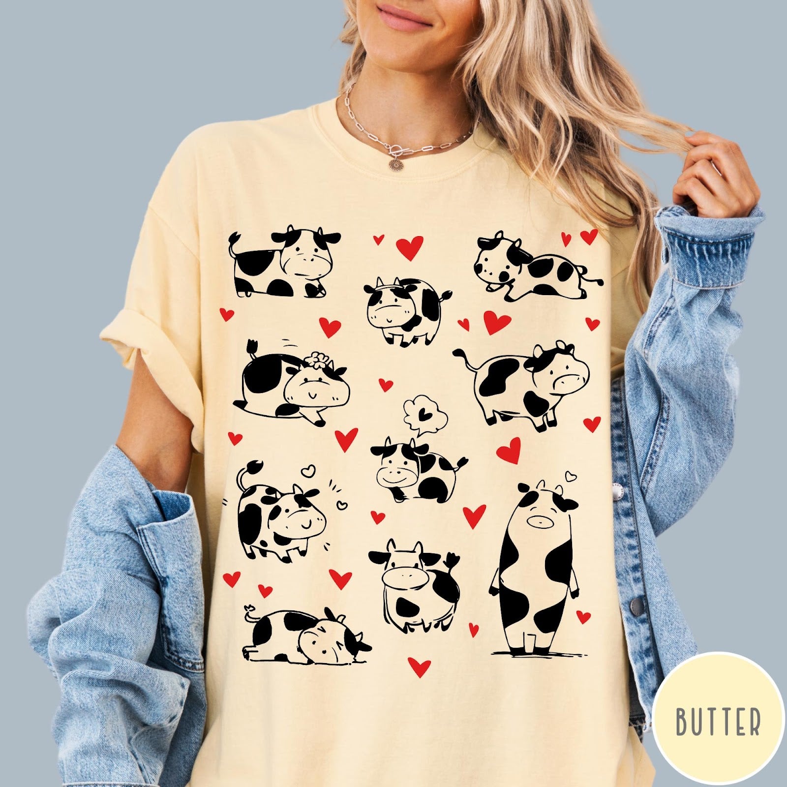 Comfort Colors tee in Butter featuring cute cow lover graphic with various black and white cow illustrations