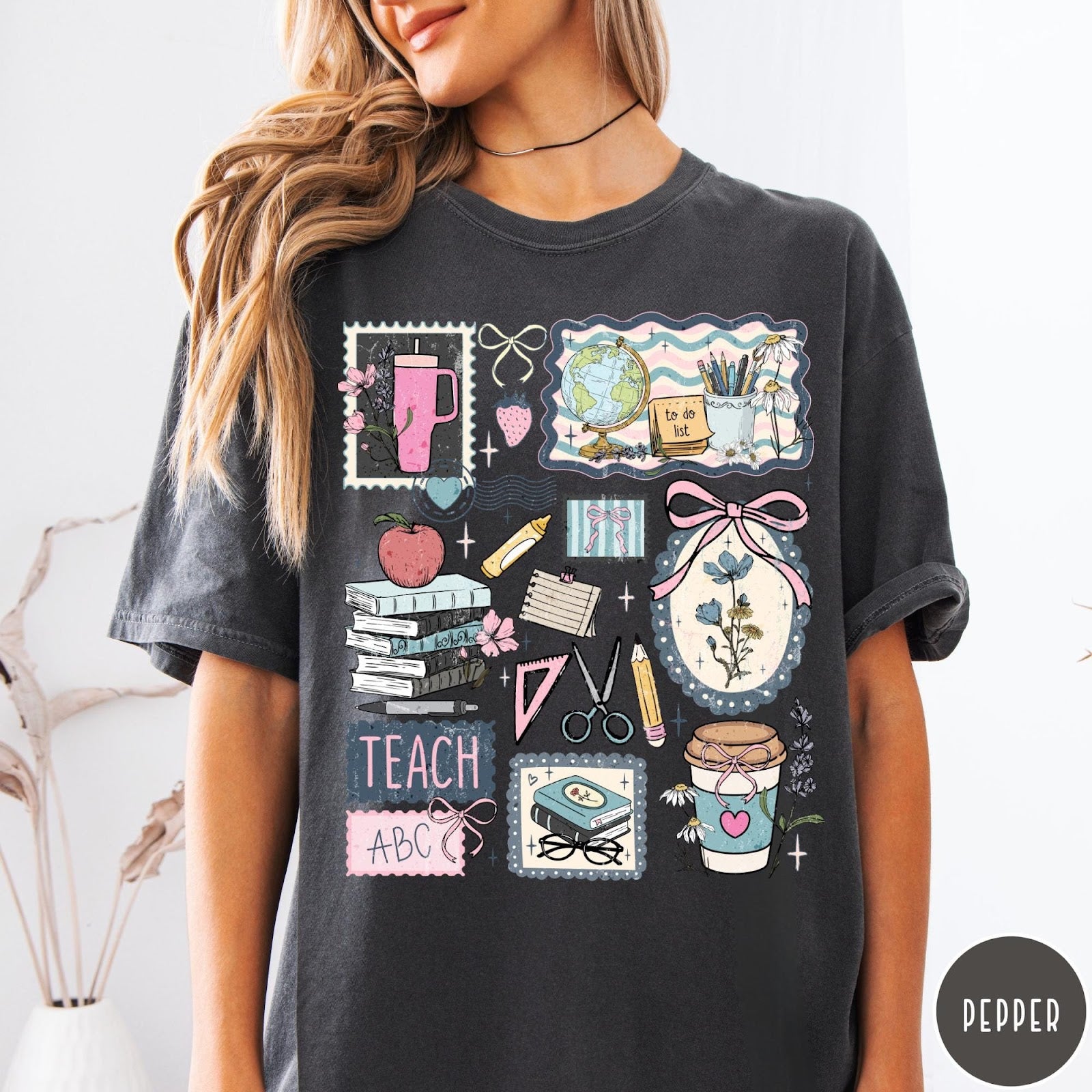 Comfort Colors tee in Pepper featuring collage style graphic with school supplies, books, and teacher life elements