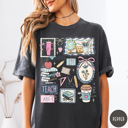 Comfort Colors tee in Pepper featuring collage style graphic with school supplies, books, and teacher life elements
