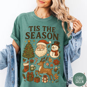 Comfort Colors tee in Light Green featuring Christmas collage graphic with Santa, snowman, reindeer, and holiday gifts