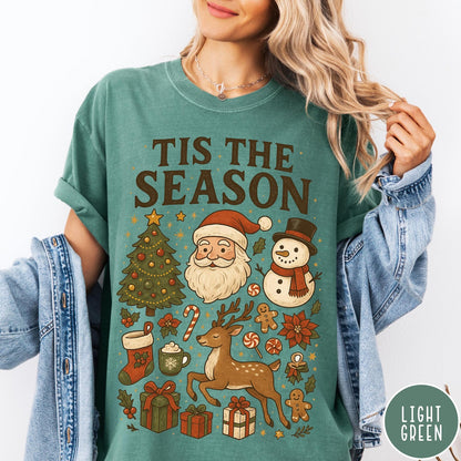 Comfort Colors tee in Light Green featuring Christmas collage graphic with Santa, snowman, reindeer, and holiday gifts
