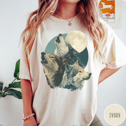 Comfort Colors tee in Ivory featuring vintage style graphic of three wolves howling at a full moon