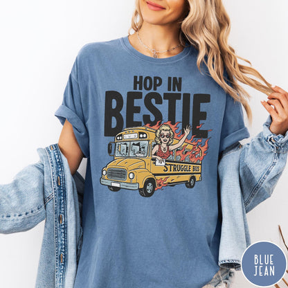 Comfort Colors tee in Blue Jean featuring retro cartoon style graphic of a woman driving a burning bus