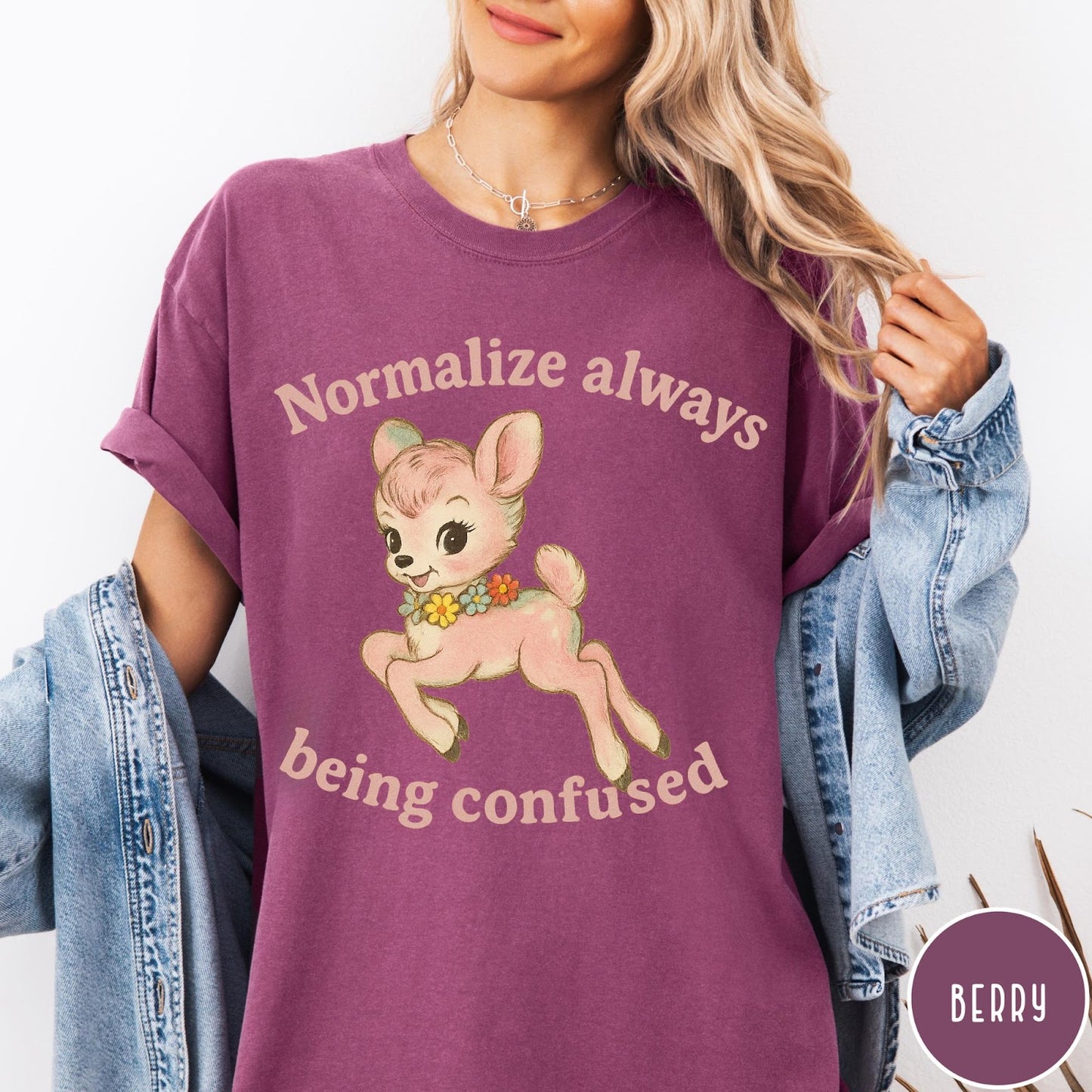 Comfort Colors tee in Berry featuring vintage style fawn graphic with flowers and Normalize Always Being Confused text