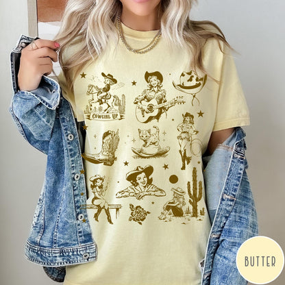 Comfort Colors tee in Butter featuring retro western collage graphic with cowgirls, boots, and desert elements