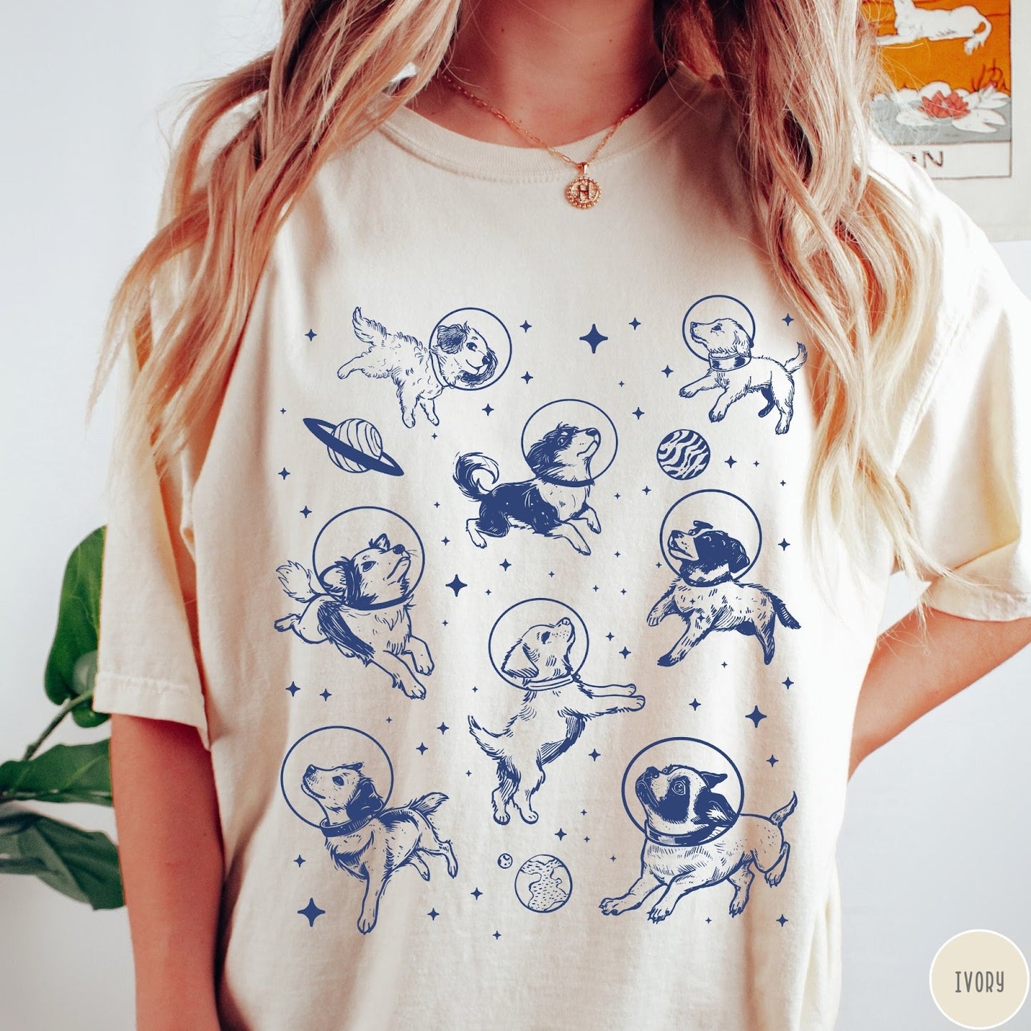 Comfort Colors tee in Ivory featuring space theme graphic with various dogs wearing astronaut helmets and planets