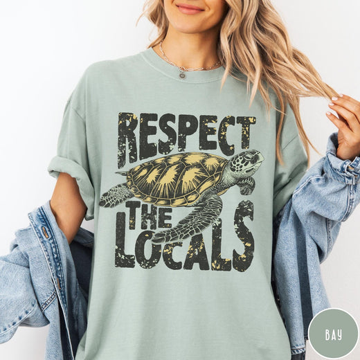 Comfort Colors tee in Bay featuring vintage style sea turtle graphic with Respect the Locals text