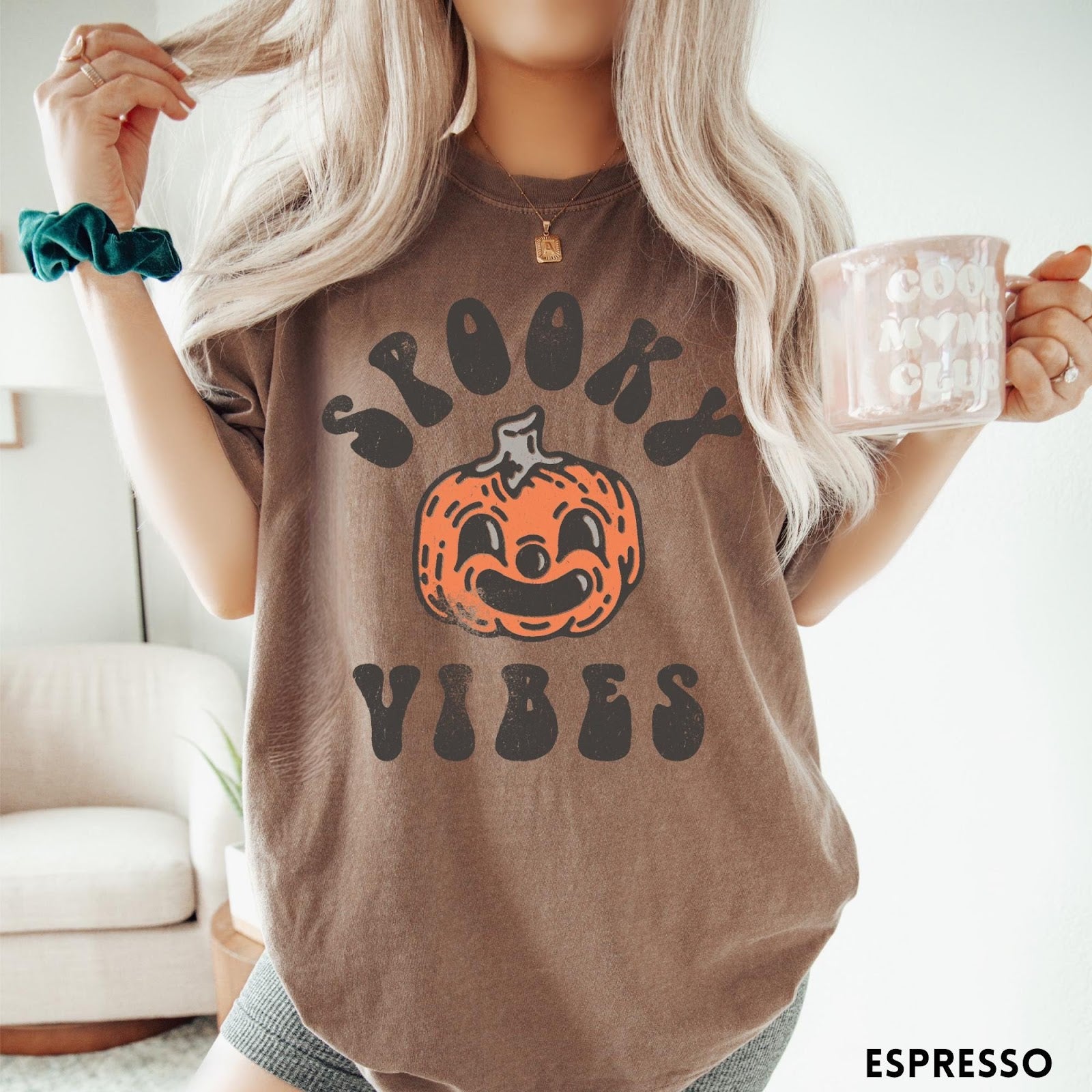 Comfort Colors tee in Espresso featuring retro style graphic with a smiling pumpkin and Spooky Vibes text