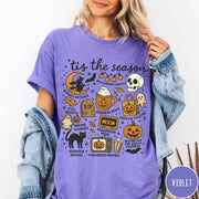 Comfort Colors tee in Violet featuring Halloween icons collage with witch, skull, pumpkin, and spooky fall graphics
