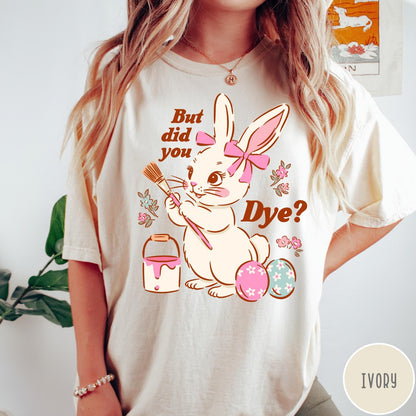 Comfort Colors tee in Ivory featuring Easter bunny design with paintbrush, paint bucket, and decorated Easter eggs
