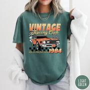 Comfort Colors tee in Light Green featuring vintage muscle car graphic with racing flags and 1984 text