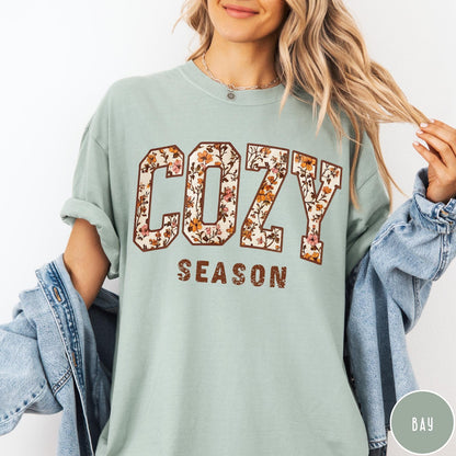 Comfort Colors tee in Bay featuring autumnal floral typography with a cozy season graphic design