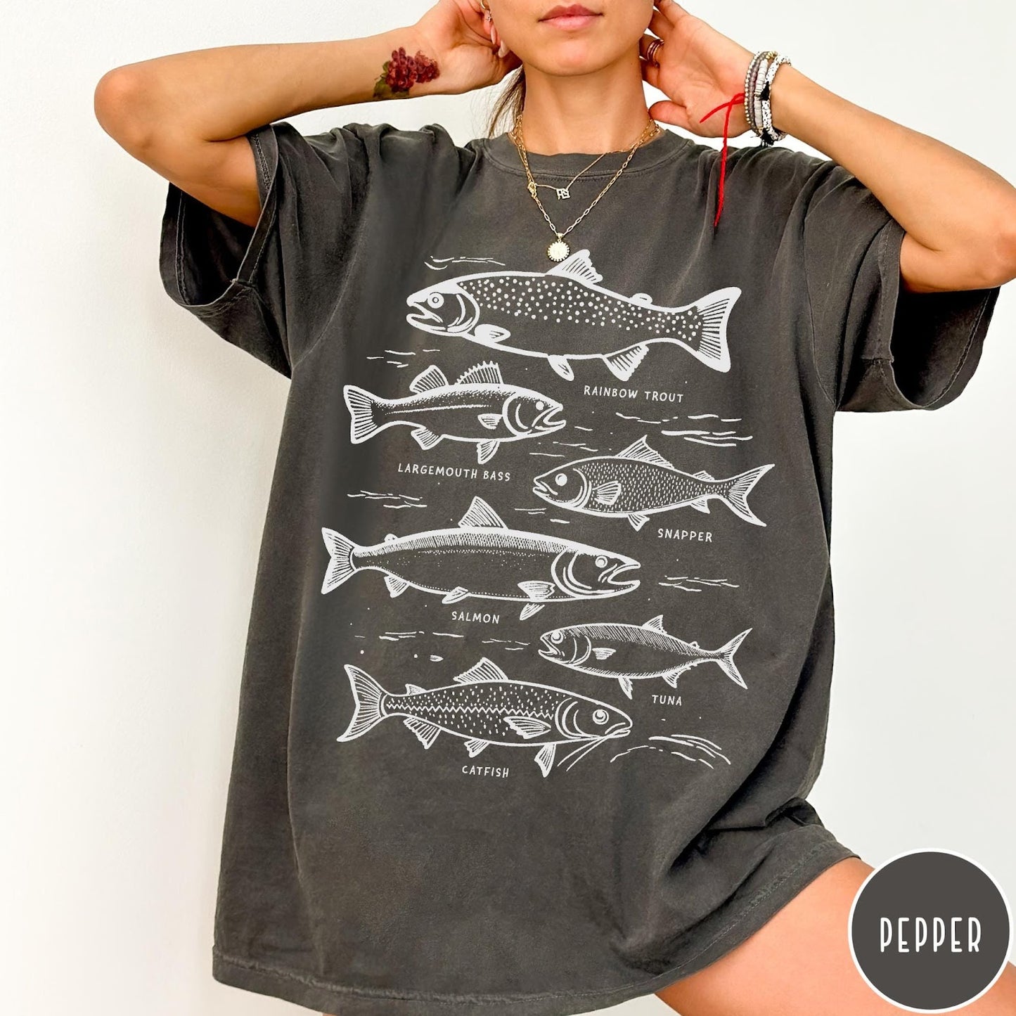Comfort Colors tee in Pepper featuring vintage line illustration of various fish species with their names labeled.