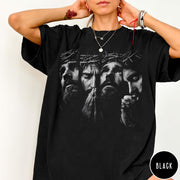 Comfort Colors tee in black featuring a graphic of Jesus with a crown of thorns praying