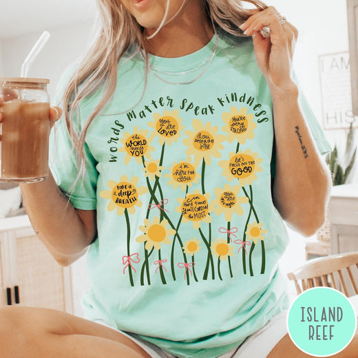 Comfort Colors tee in Island Reef featuring daisy graphic with positive affirmations and encouraging words about kindness