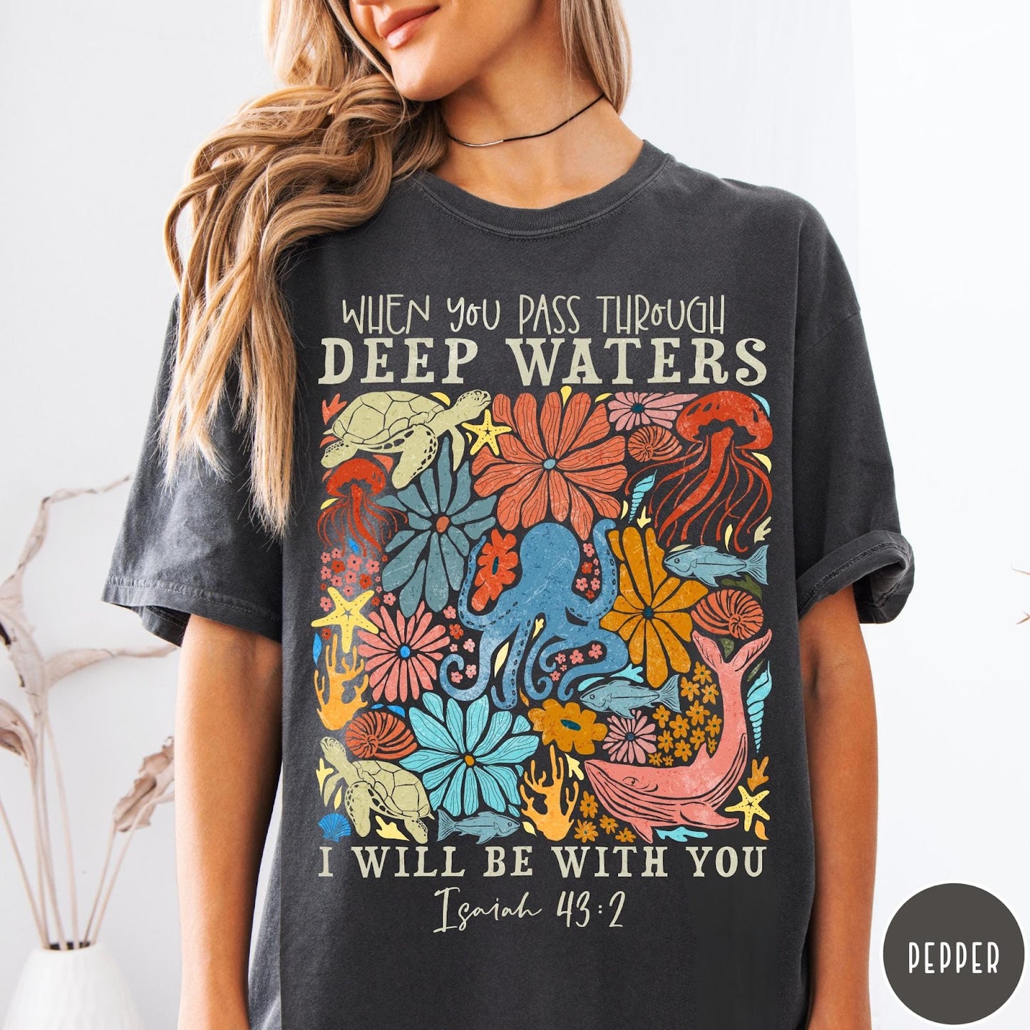 Comfort Colors tee in Pepper featuring artistic marine life graphic with Isaiah 43:2 Bible verse text