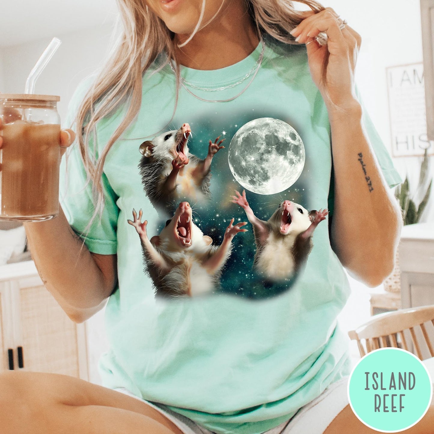 Comfort Colors tee in Island Reef featuring vintage graphic style with three screaming possums reaching for the moon