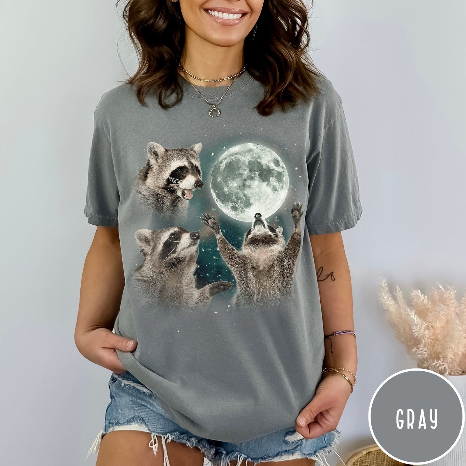 Comfort Colors tee in Gray featuring artistic graphic of three raccoons reaching toward a bright full moon