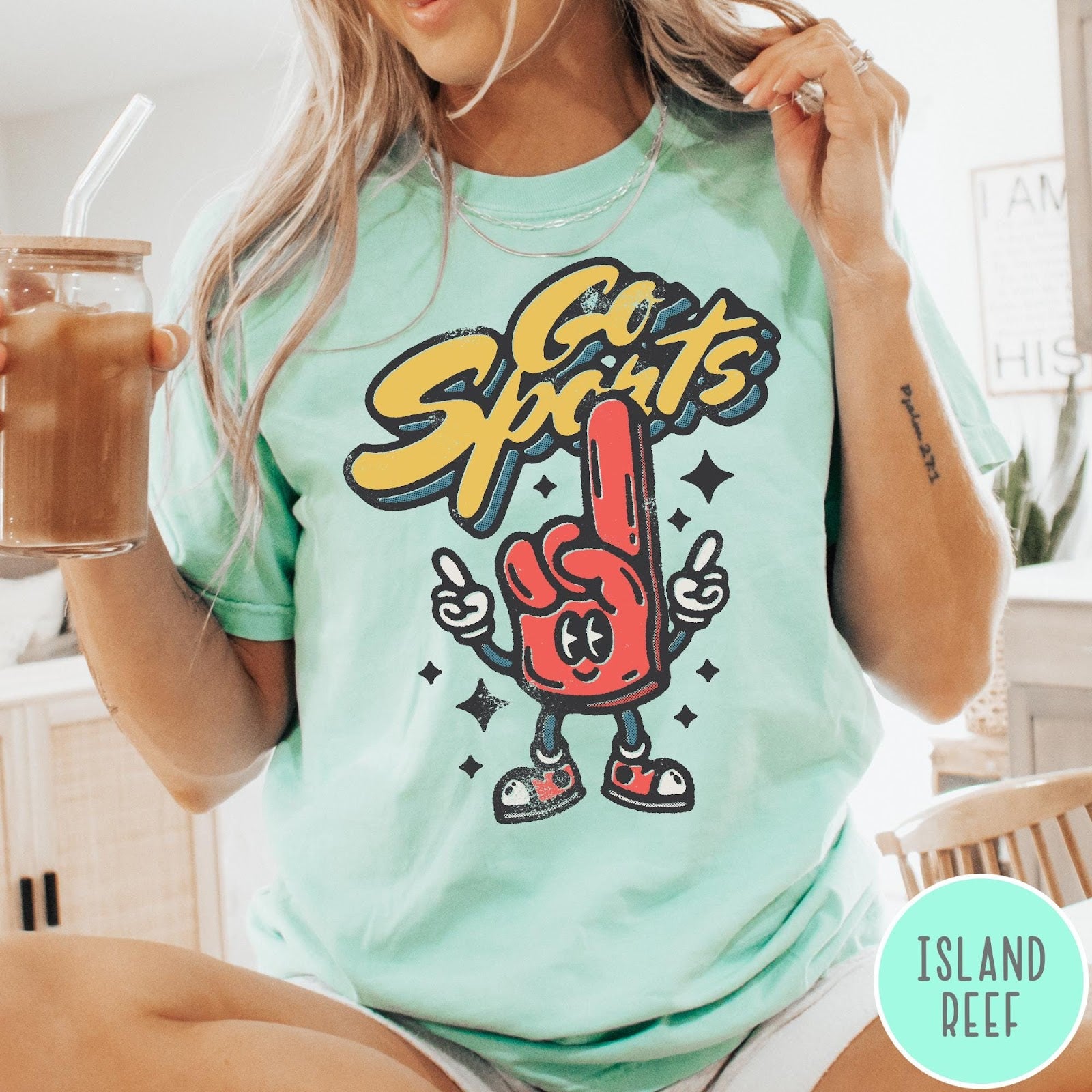 Comfort Colors tee in Island Reef featuring retro mascot design with a red foam finger and Go Sports text