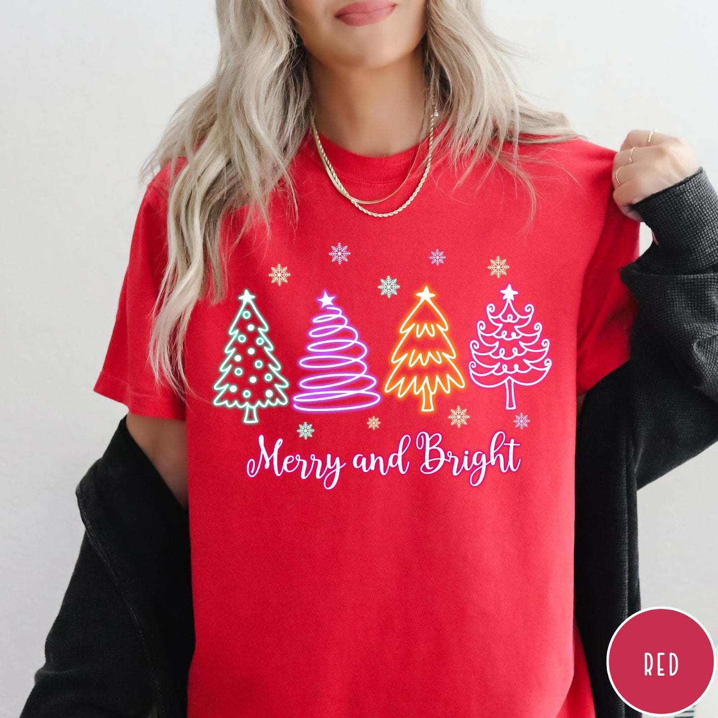 Comfort Colors tee in Red featuring neon Christmas tree graphic with Merry and Bright text and snowflakes