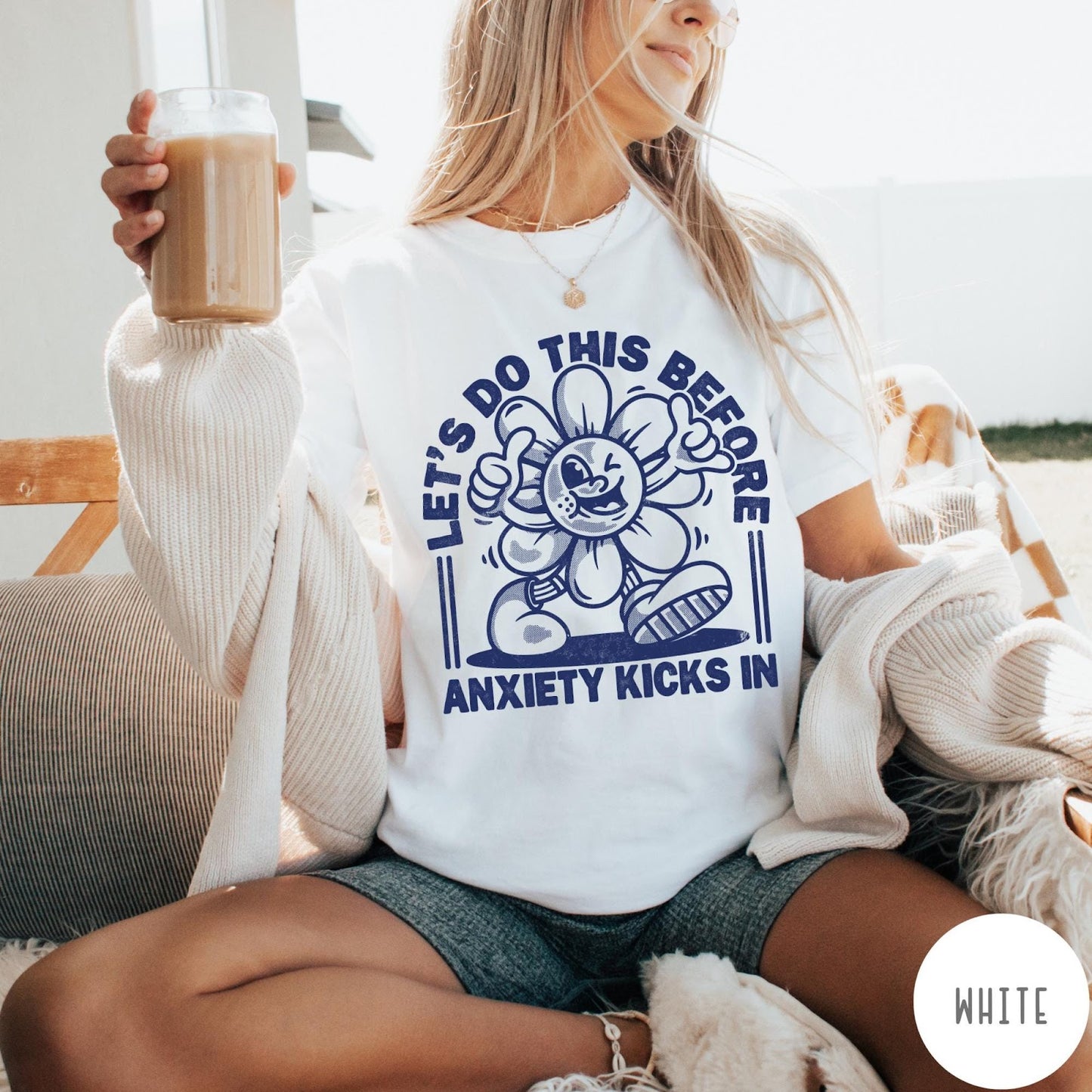 Comfort Colors tee in White featuring retro graphic style winking flower character with anxiety text design