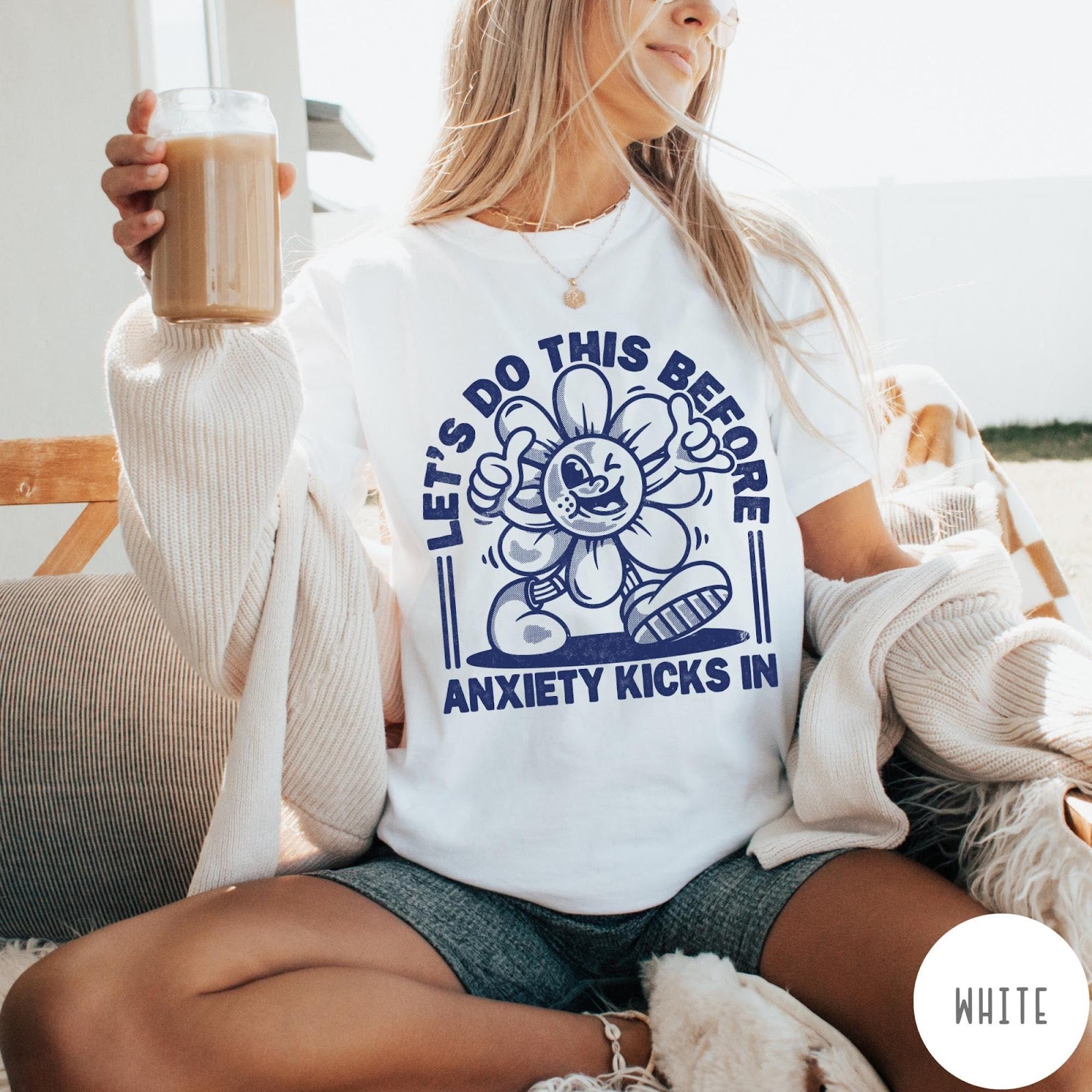 Comfort Colors tee in White featuring retro graphic style winking flower character with anxiety text design