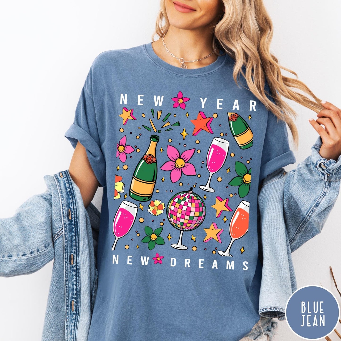 Comfort Colors tee in Blue Jean featuring New Year celebration graphic with champagne bottles, glasses, and disco ball