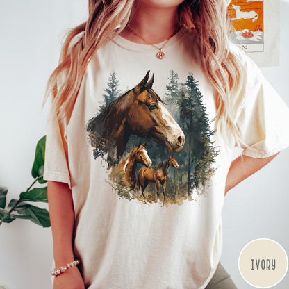 Comfort Colors tee in Ivory featuring vintage style graphic of three horses standing in a pine forest
