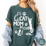 Comfort Colors tee in Blue Spruce featuring vintage style graphic with cats, paw prints, and cat mom club text