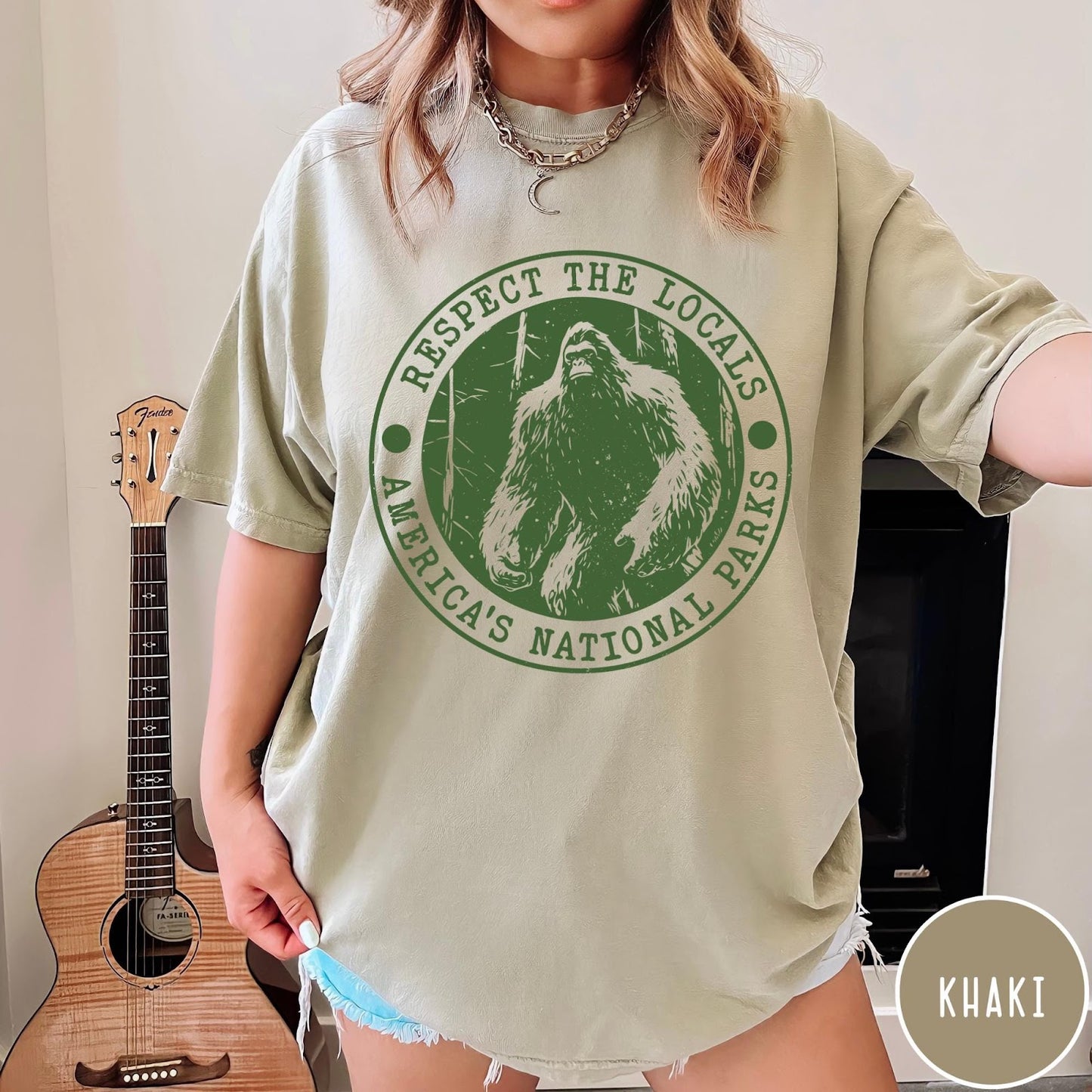Comfort Colors tee in Khaki featuring circular graphic design with Bigfoot and Respect the Locals text