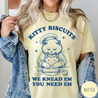 Comfort Colors tee in Butter featuring cat baking biscuits graphic with chef hat and rolling pin illustration