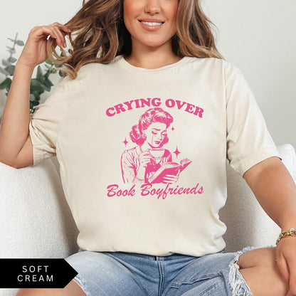 Comfort Colors tee in Soft Cream featuring retro style graphic of a woman crying while reading a book