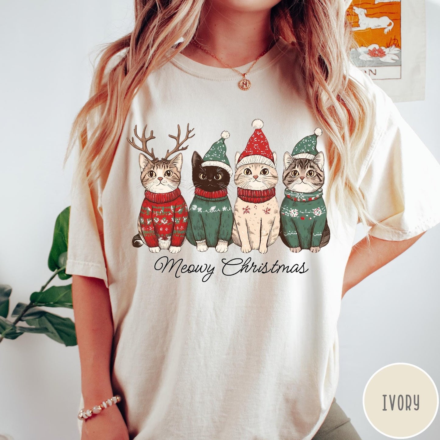 Comfort Colors tee in Ivory featuring holiday graphic of four cats wearing Christmas sweaters and hats