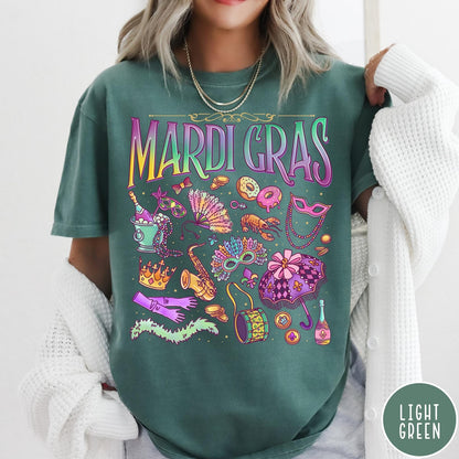 Comfort Colors tee in Light Green featuring vintage style Mardi Gras celebration icons including masks, beads, and saxophone