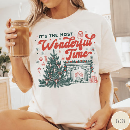 Comfort Colors tee in Ivory featuring Christmas design with a decorated tree and a cozy fireplace scene