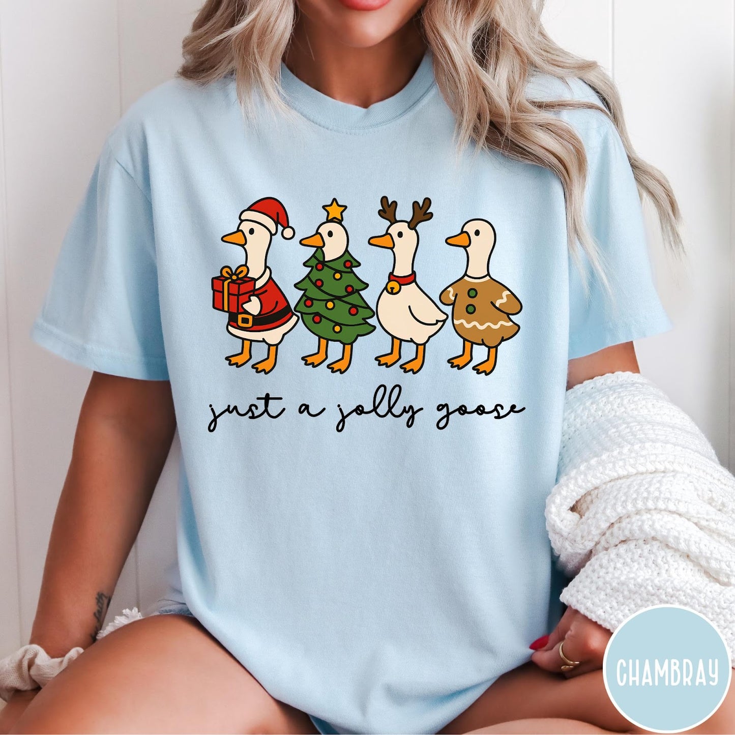 Comfort Colors tee in Chambray featuring festive geese dressed as Santa, Christmas tree, reindeer, and gingerbread