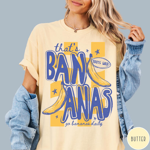Comfort Colors tee in Butter featuring retro style banana graphic with text that is bananas go bananas daily