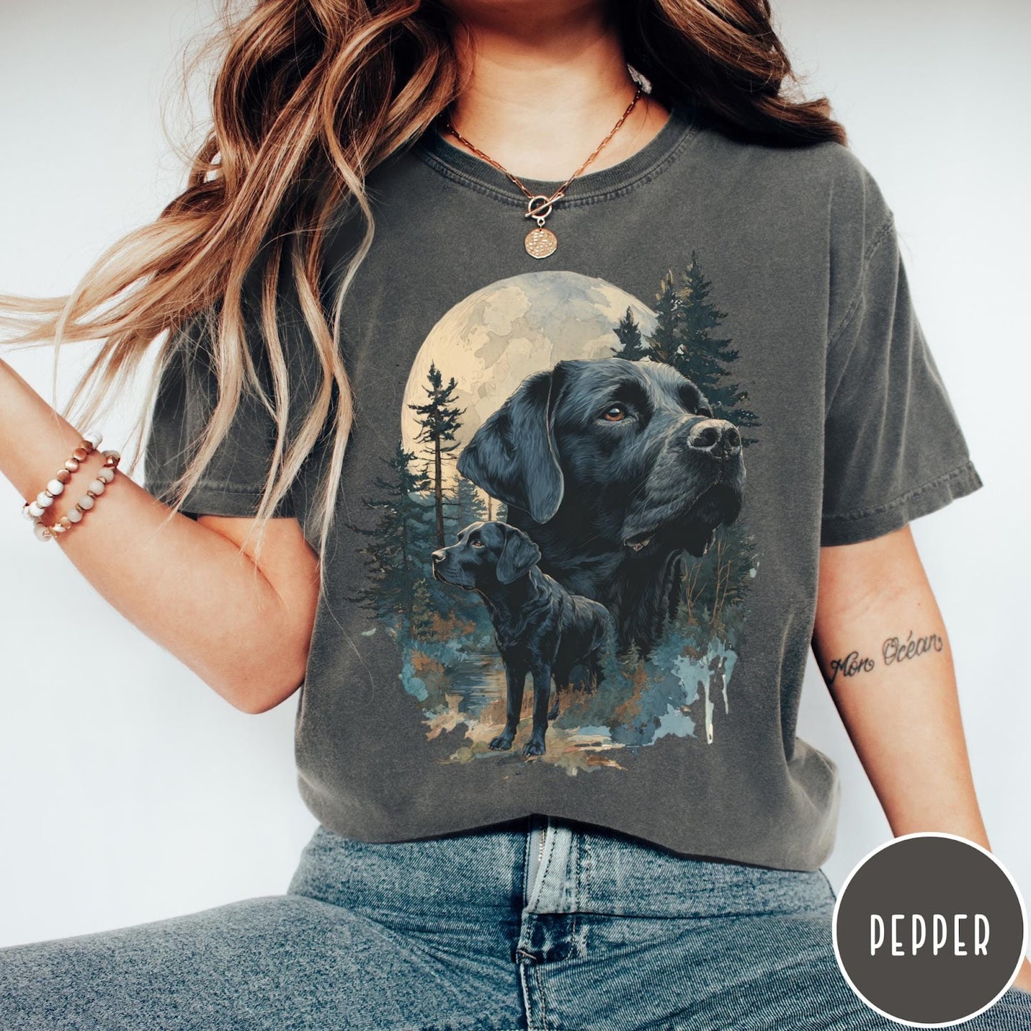 Comfort Colors tee in Pepper featuring artistic graphic of Black Labrador dogs in a forest moon setting