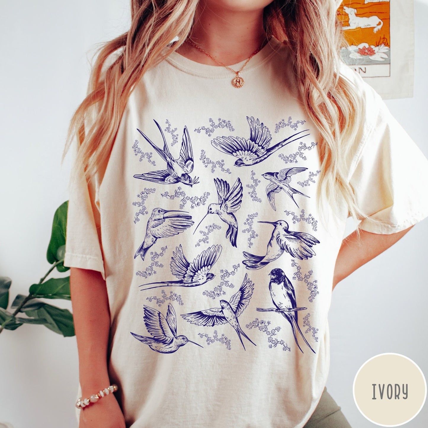 Comfort Colors tee in Ivory featuring vintage bird tattoo style graphic with various birds and flowers