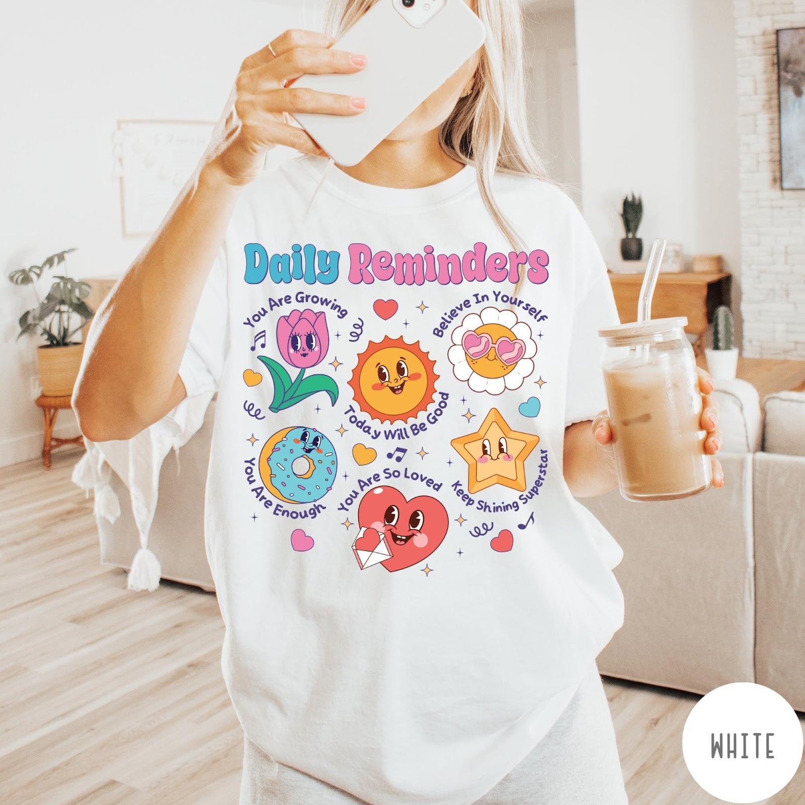 Comfort Colors tee in White featuring retro mascot graphic with daily affirmations and cute cartoon characters