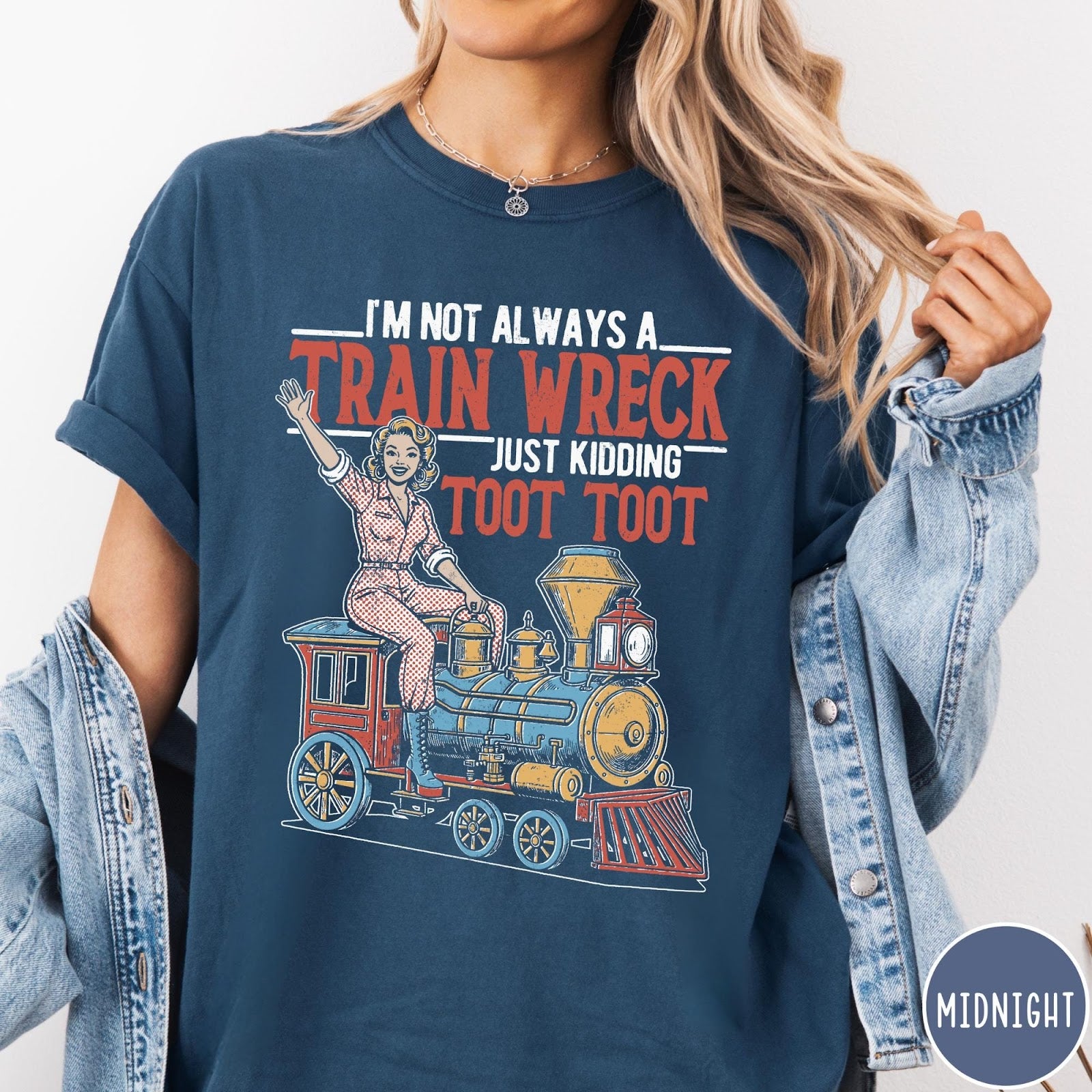 Comfort Colors tee in Midnight featuring vintage pin-up style graphic of a woman riding a steam train