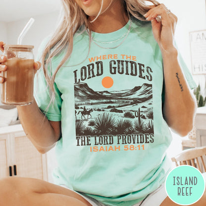 Comfort Colors tee in Island Reef featuring desert landscape graphic with a rider and sun design.
