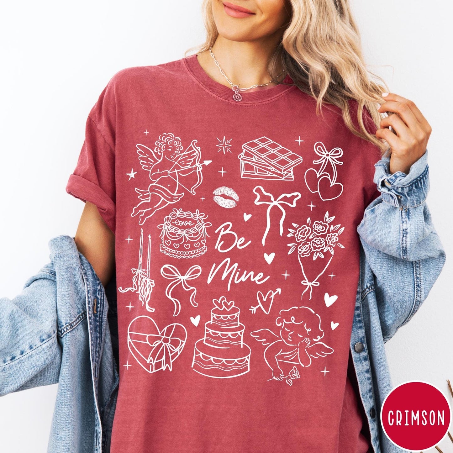 Comfort Colors tee in Crimson featuring Valentine's Day collage design with cupid, cake, flowers, and chocolate graphics