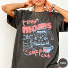 Comfort Colors tee in Pepper featuring coffee themed graphic with teapot and stacked mugs and text design