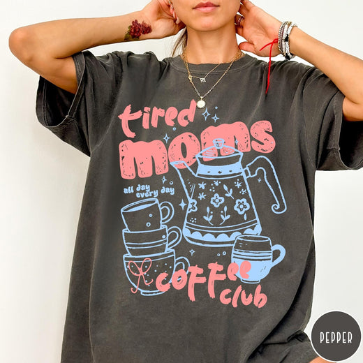 Comfort Colors tee in Pepper featuring coffee themed graphic with teapot and stacked mugs and text design
