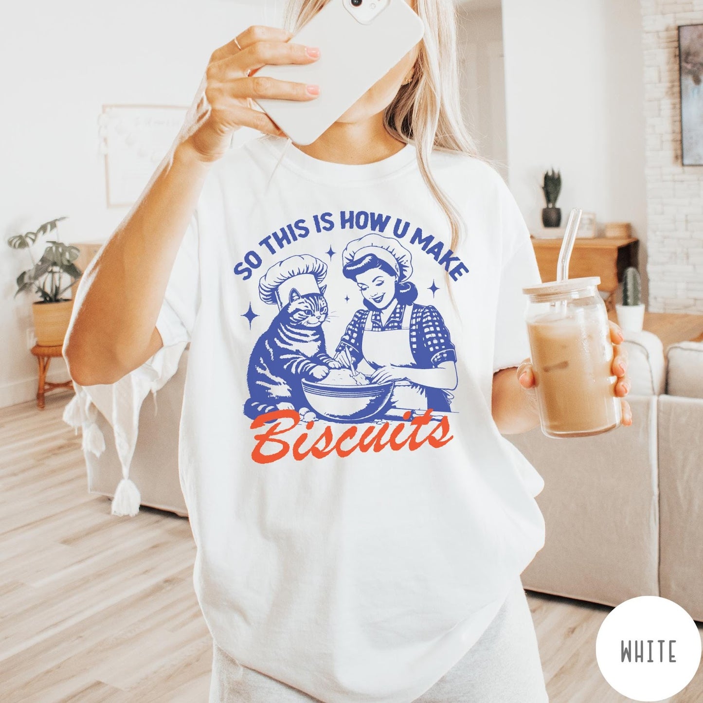 Comfort Colors tee in White featuring vintage style graphic of a woman and cat baking biscuits together