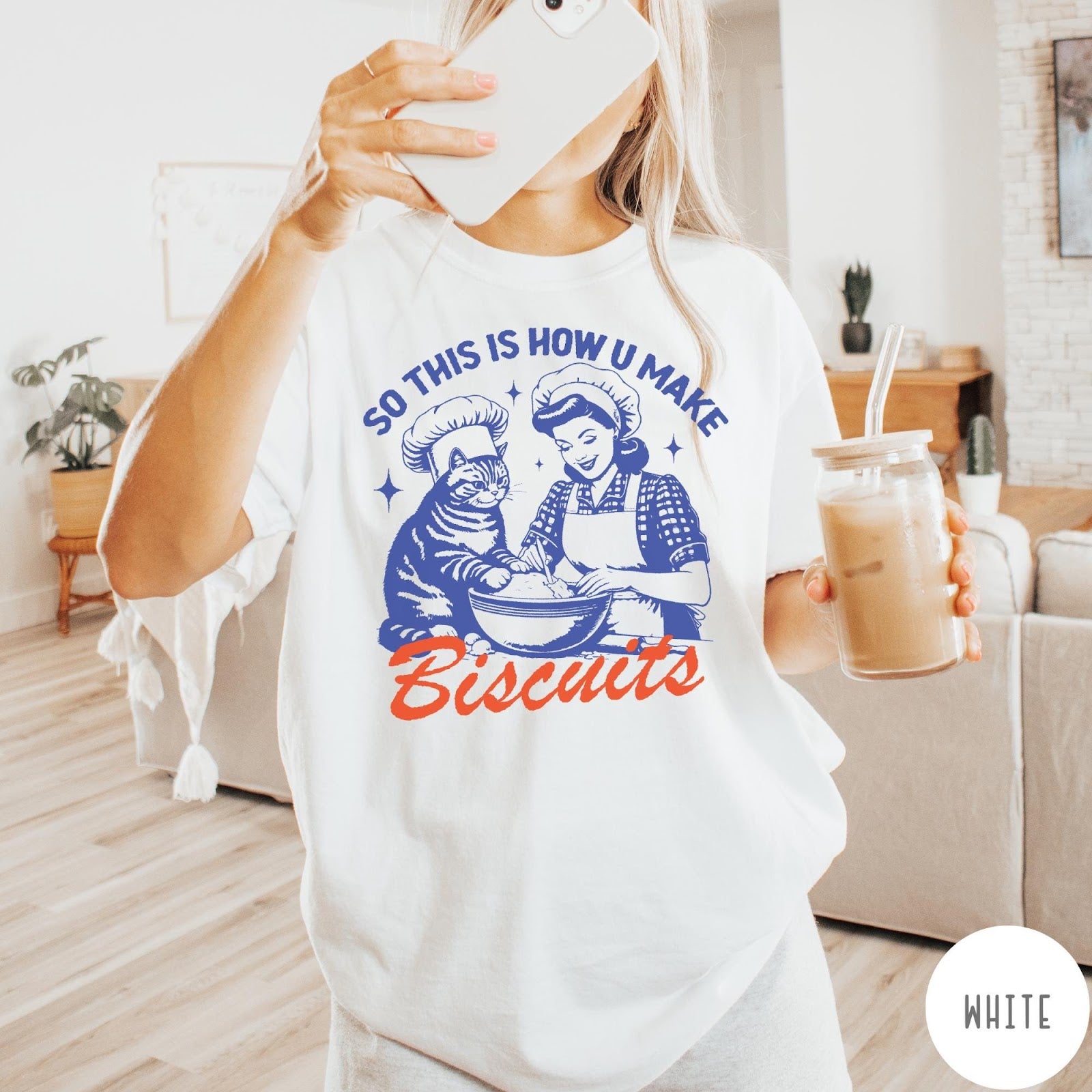 Comfort Colors tee in White featuring vintage style graphic of a woman and cat baking biscuits together