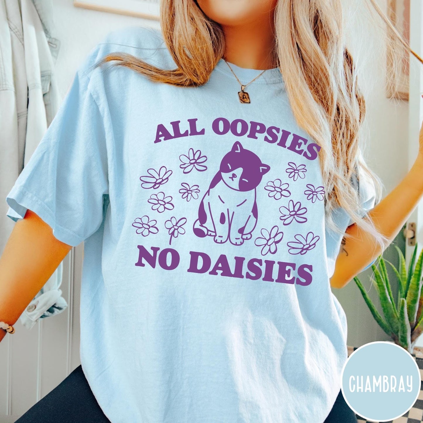Comfort Colors tee in Chambray featuring cute cat graphic with purple text reading All Oopsies No Daisies