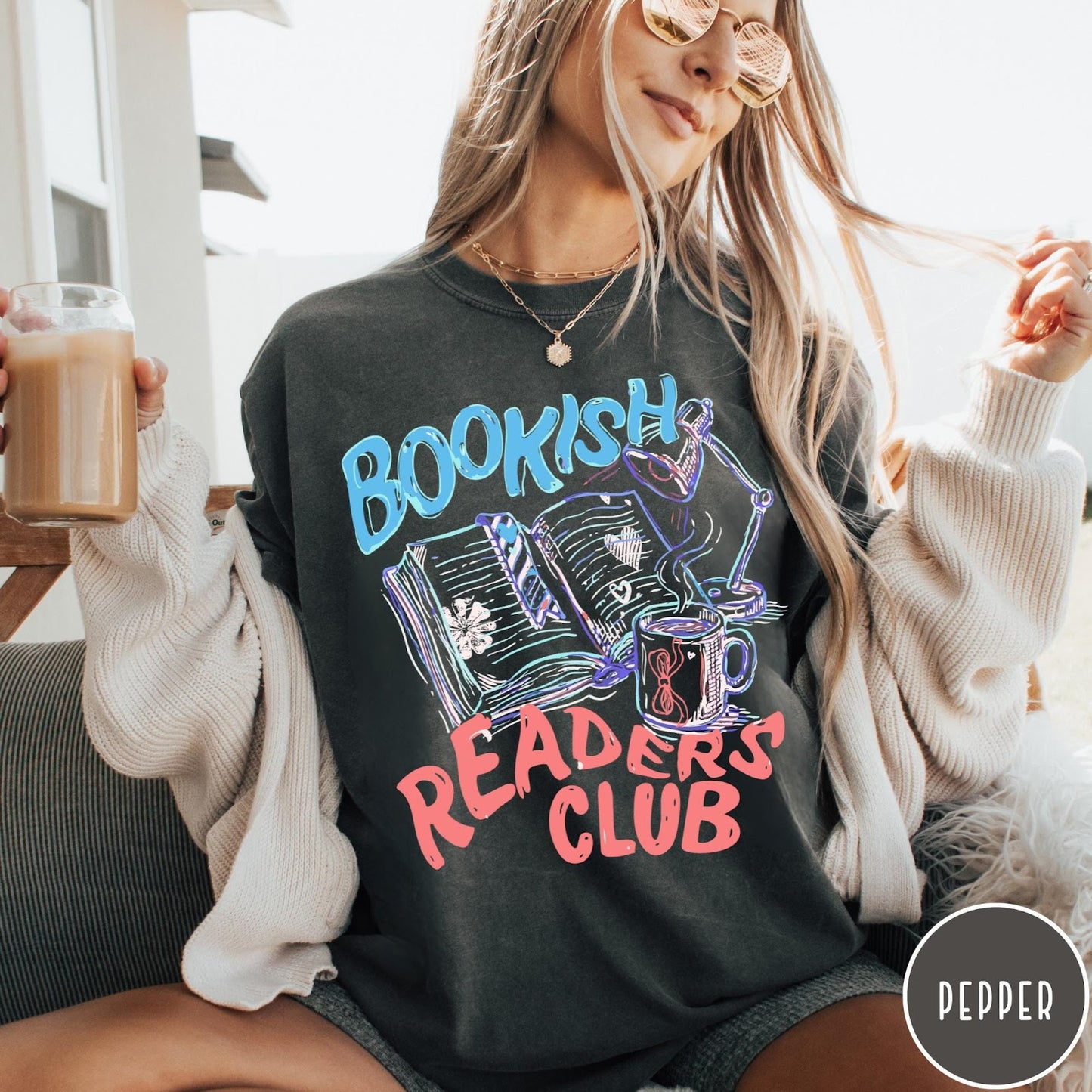 Comfort Colors tee in Pepper featuring illustrated book graphic with a lamp and a coffee mug design
