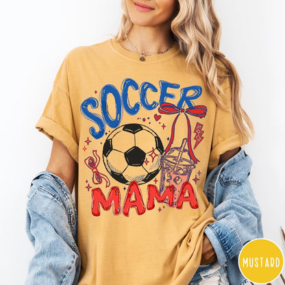 Comfort Colors tee in Mustard featuring soccer graphic with a soccer ball, iced coffee, and red bow
